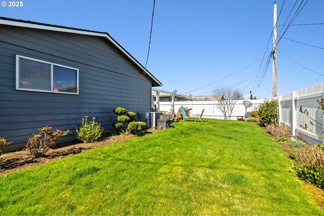 view of yard with cooling unit and fence