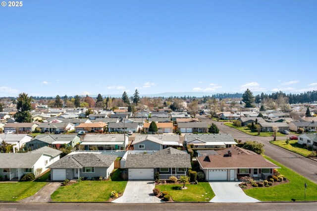 birds eye view of property with a residential view