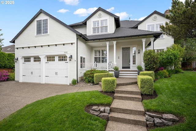 view of front facade featuring a porch, a front yard, concrete driveway, a shingled roof, and an attached garage