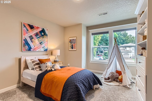 10445 SW 141st Ave, Beaverton, OR 97008 - carpeted bedroom featuring baseboards and a textured ceiling