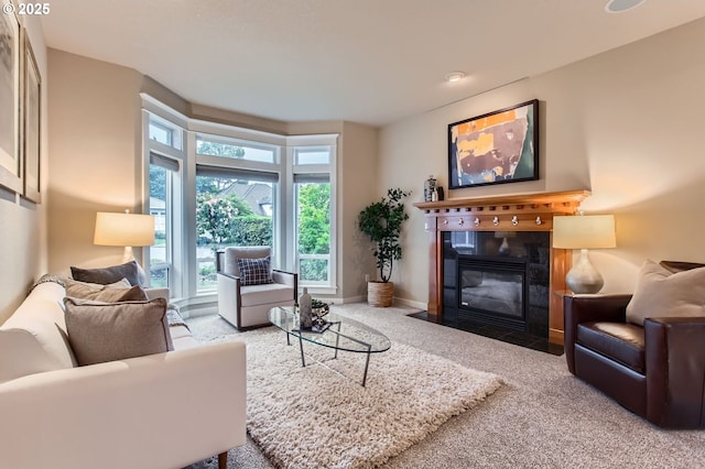 10445 SW 141st Ave, Beaverton, OR 97008 - carpeted living room with a fireplace and baseboards