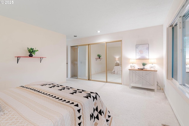 bedroom with carpet floors and a closet