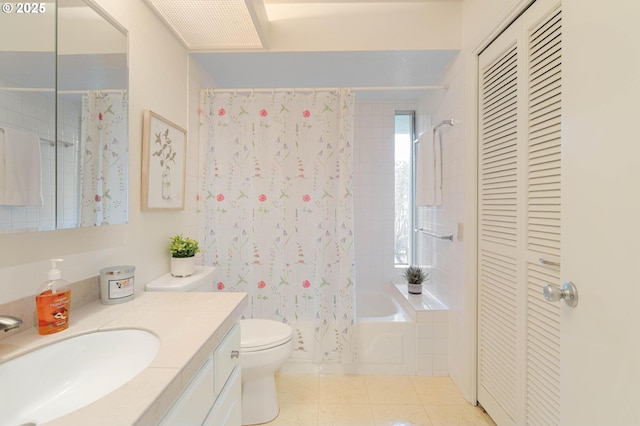 full bath featuring toilet, shower / tub combo with curtain, tile patterned flooring, a closet, and vanity