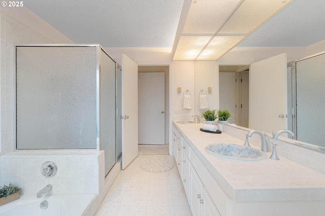 bathroom featuring tile patterned floors, vanity, and independent shower and bath