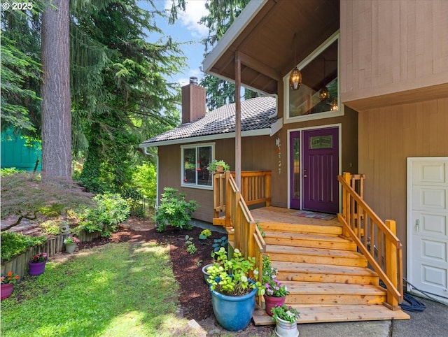 4415 Poplar Way, Longview, WA 98632 - view of exterior entry with a chimney and a tile roof