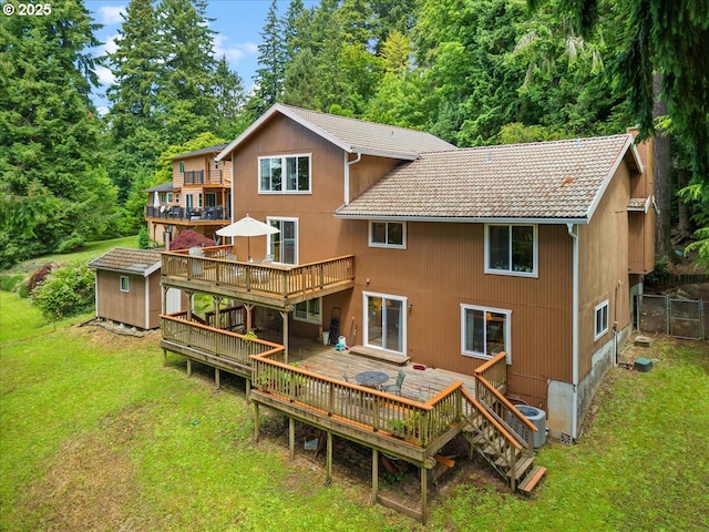 4415 Poplar Way, Longview, WA 98632 - rear view of property featuring a deck, a yard, and a tiled roof