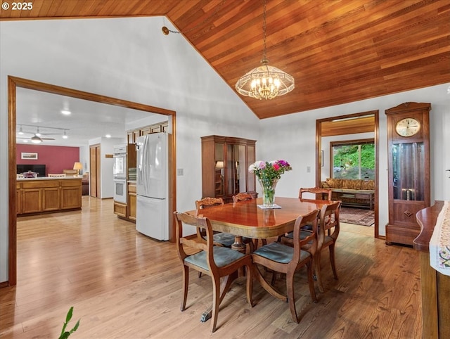 4415 Poplar Way, Longview, WA 98632 - dining room featuring wood ceiling, a chandelier, light wood-style floors, high vaulted ceiling, and a ceiling fan