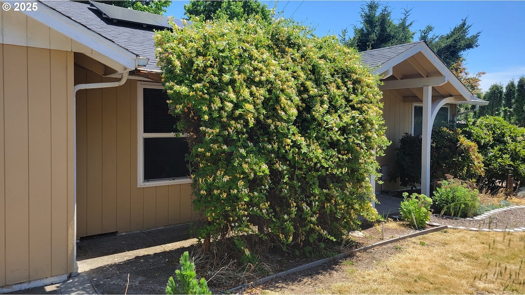 3623 Marion St SE, Albany, OR 97322 - view of property exterior featuring a shingled roof and solar panels