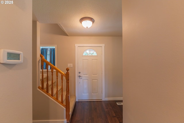 29115 NE 99th Ave, Battle Ground, WA 98604 - entryway with baseboards, dark wood-style flooring, a textured ceiling, and stairway