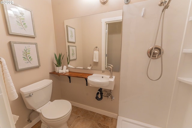 29115 NE 99th Ave, Battle Ground, WA 98604 - bathroom with a walk in shower, toilet, a sink, baseboards, and tile patterned floors