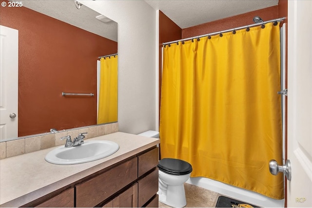 bathroom with toilet, curtained shower, and vanity