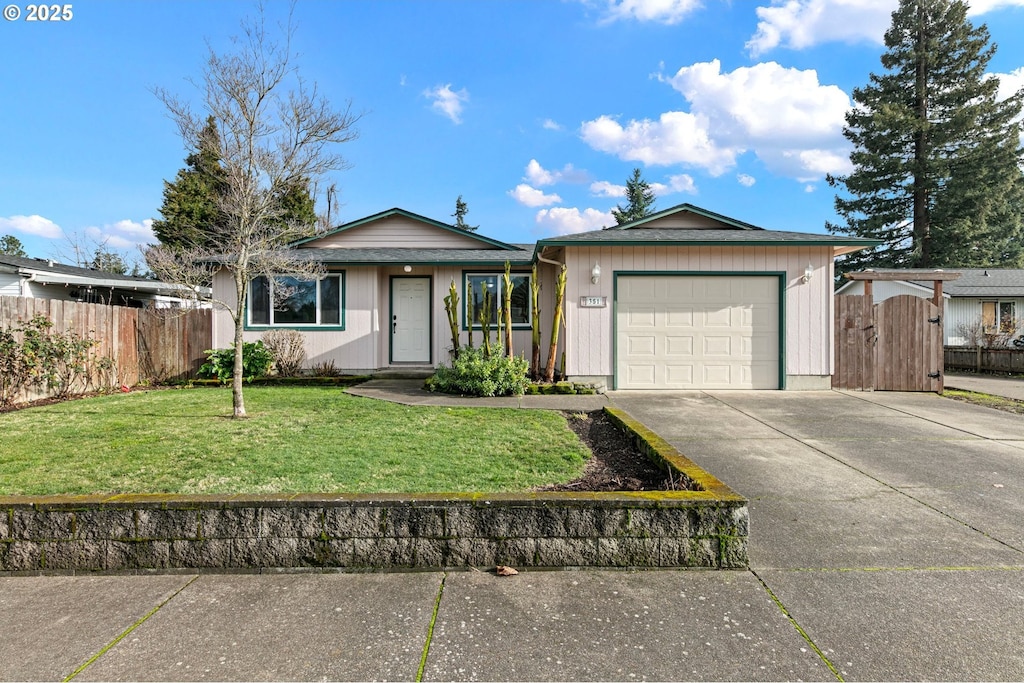 single story home featuring a front yard and a garage