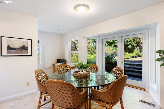 2941 SW Moss St, Portland, OR 97219 - dining room with light tile patterned floors and baseboards