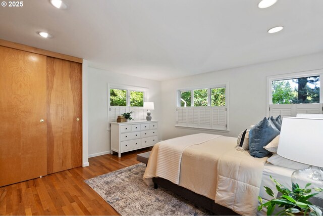 2941 SW Moss St, Portland, OR 97219 - bedroom with wood finished floors, recessed lighting, and baseboards