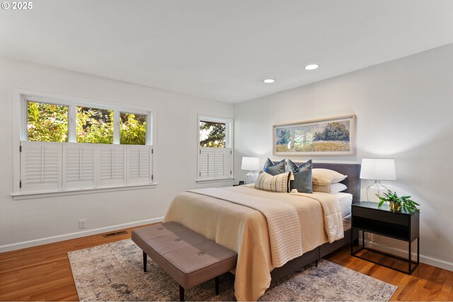 2941 SW Moss St, Portland, OR 97219 - bedroom featuring baseboards, recessed lighting, and wood finished floors