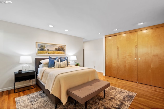2941 SW Moss St, Portland, OR 97219 - bedroom featuring light wood finished floors, recessed lighting, and baseboards