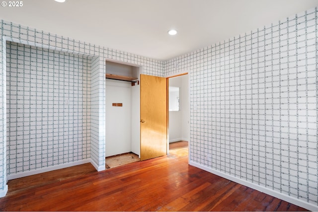 2941 SW Moss St, Portland, OR 97219 - unfurnished bedroom with hardwood / wood-style floors, baseboards, recessed lighting, a closet, and wallpapered walls