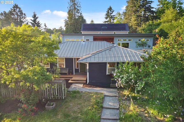 2941 SW Moss St, Portland, OR 97219 - rear view of house with a standing seam roof, metal roof, and a wooden deck