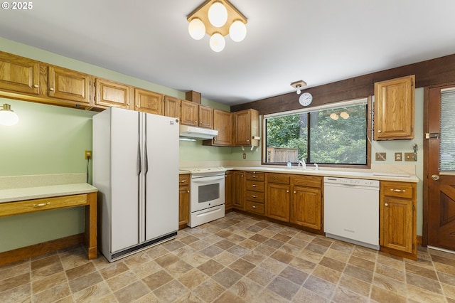 2 Icarus Loop, Lake Oswego, OR 97035 - kitchen with white appliances, under cabinet range hood, stone finish flooring, and light countertops