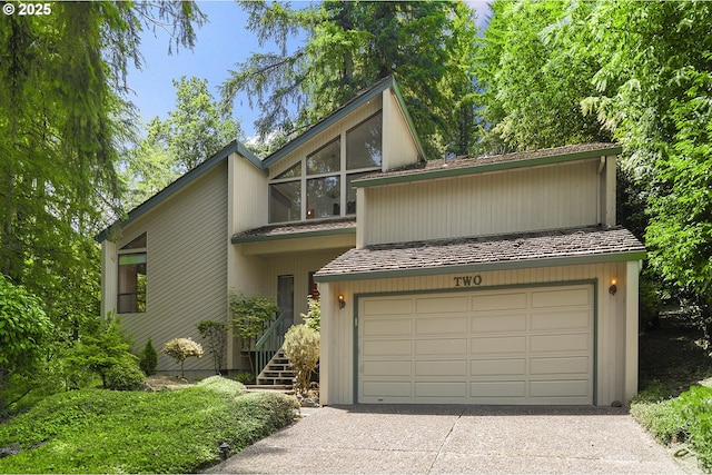 2 Icarus Loop, Lake Oswego, OR 97035 - mid-century modern home featuring a garage and concrete driveway