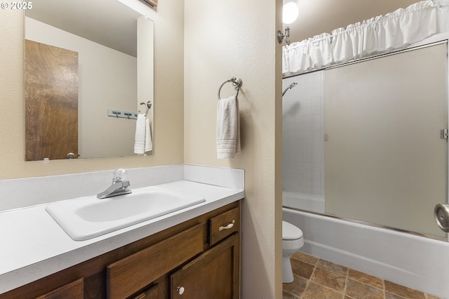 2 Icarus Loop, Lake Oswego, OR 97035 - bathroom featuring vanity, bath / shower combo with glass door, and stone finish flooring