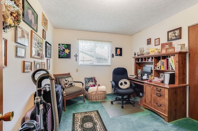 carpeted office space featuring a textured ceiling