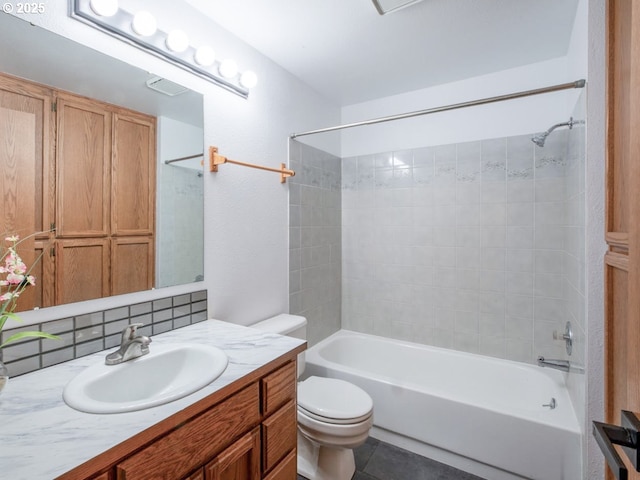 bathroom featuring tile patterned flooring, vanity, bathtub / shower combination, toilet, and backsplash