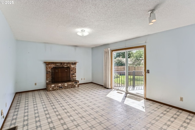 13230 SW Hill Ct, Portland, OR 97223 - unfurnished living room with a textured ceiling, baseboards, and a brick fireplace