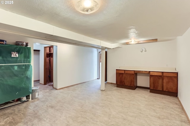 13230 SW Hill Ct, Portland, OR 97223 - finished below grade area featuring light floors, baseboards, and a textured ceiling