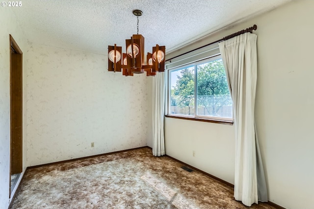 13230 SW Hill Ct, Portland, OR 97223 - carpeted empty room featuring a chandelier, a textured ceiling, and visible vents