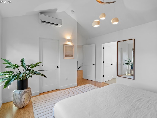 4566 NE Cesar E Chavez Blvd, Portland, OR 97211 - bedroom featuring a wall unit AC, high vaulted ceiling, and light wood-style flooring