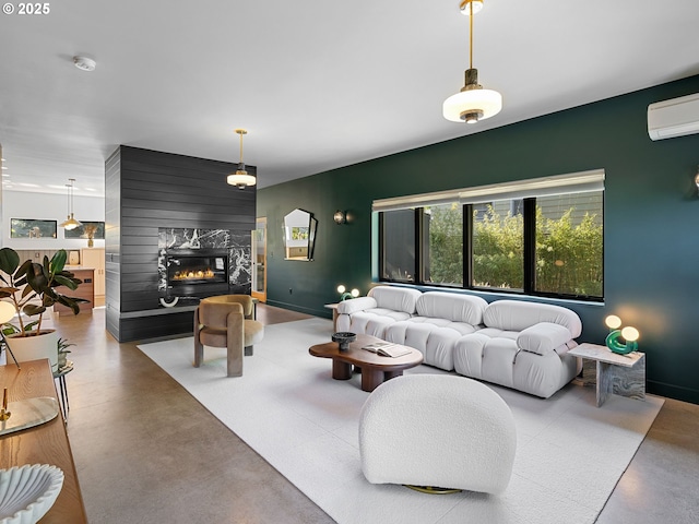 4566 NE Cesar E Chavez Blvd, Portland, OR 97211 - living room with finished concrete flooring, an accent wall, healthy amount of natural light, and an AC wall unit