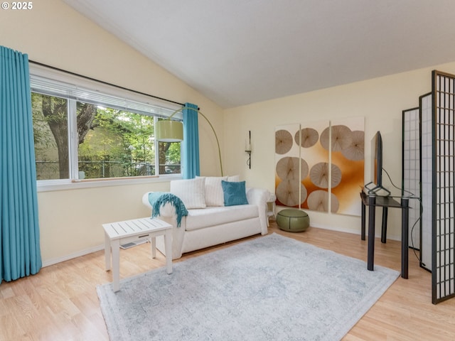 1761 SW Songbird St, Mcminnville, OR 97128 - living room featuring lofted ceiling, wood finished floors, and baseboards