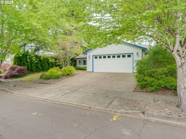 view of front of house featuring driveway and an attached garage