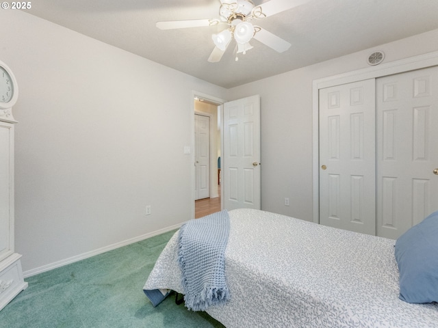 bedroom featuring carpet flooring, baseboards, a closet, and ceiling fan