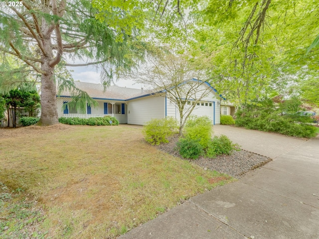 ranch-style house with driveway, an attached garage, and a front lawn