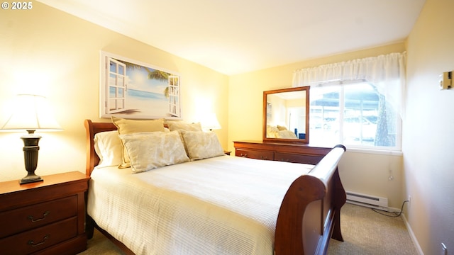 carpeted bedroom featuring a baseboard heating unit