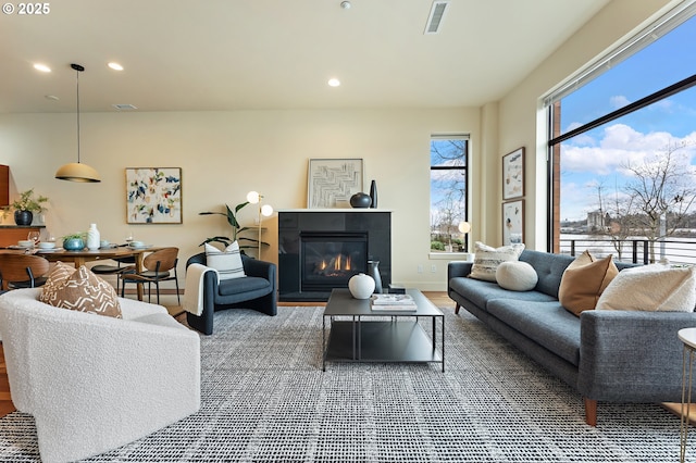 1660 NW Riverscape Dr, Portland, OR 97209 - living room with a glass covered fireplace and recessed lighting