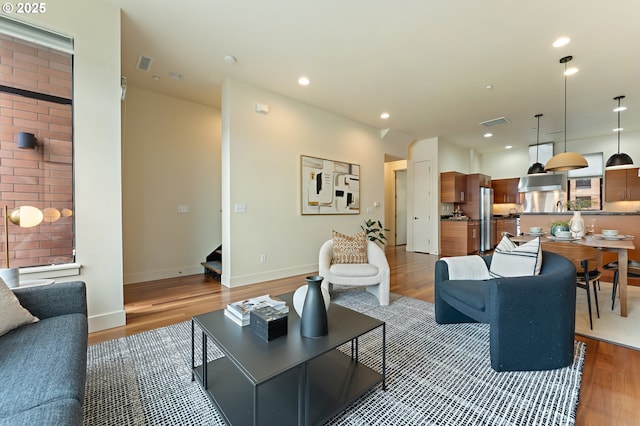 1660 NW Riverscape Dr, Portland, OR 97209 - living room with stairway, light wood-style floors, and recessed lighting