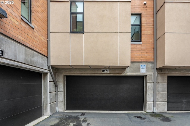 1660 NW Riverscape Dr, Portland, OR 97209 - rear view of house with a garage and brick siding