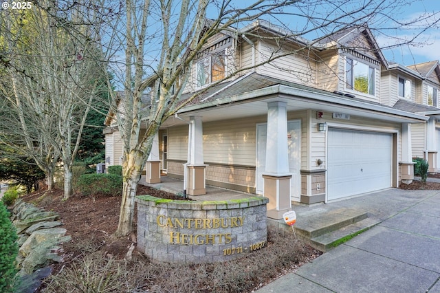 view of front of property featuring a garage and a porch