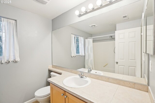 bathroom featuring vanity, a shower with curtain, and toilet