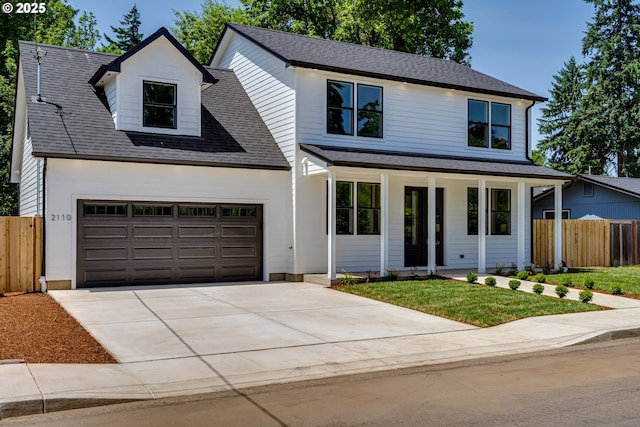 2110 Labona Dr, Eugene, OR 97404 - view of front of property with covered porch, driveway, and a shingled roof