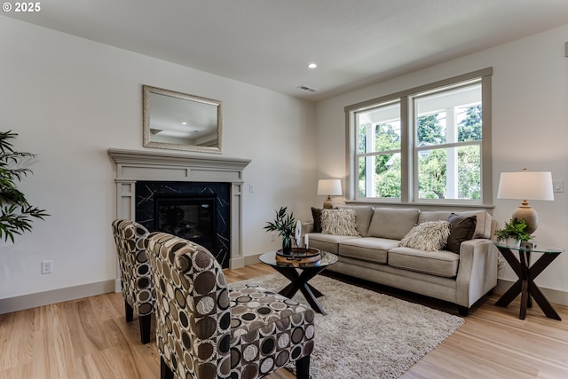 2110 Labona Dr, Eugene, OR 97404 - living room featuring light wood finished floors, recessed lighting, and a premium fireplace