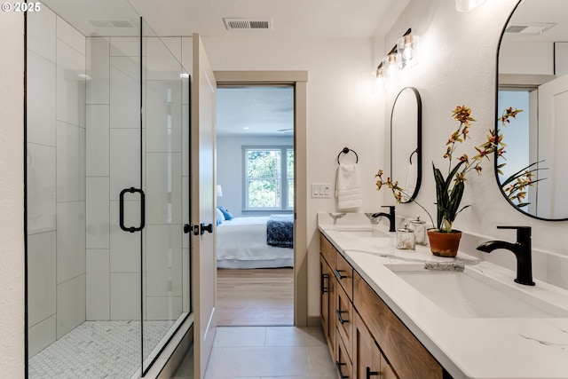2110 Labona Dr, Eugene, OR 97404 - ensuite bathroom featuring double vanity, a stall shower, and tile patterned floors