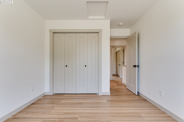 2110 Labona Dr, Eugene, OR 97404 - unfurnished bedroom with light wood-style floors, a closet, and attic access