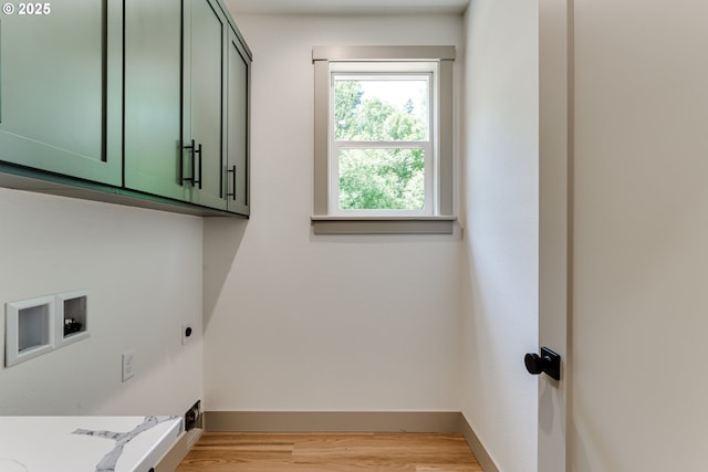2110 Labona Dr, Eugene, OR 97404 - washroom featuring cabinet space, hookup for a washing machine, light wood-style flooring, and hookup for an electric dryer