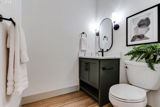 2110 Labona Dr, Eugene, OR 97404 - half bathroom featuring vanity and wood finished floors