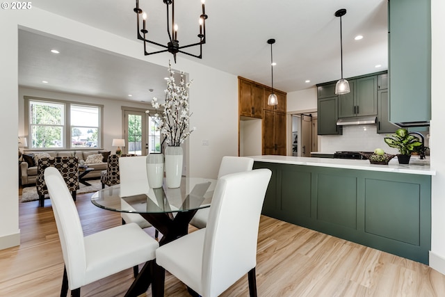 2110 Labona Dr, Eugene, OR 97404 - dining room with a chandelier, light wood finished floors, and recessed lighting