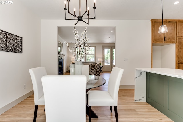 2110 Labona Dr, Eugene, OR 97404 - dining area featuring a chandelier, light wood-type flooring, recessed lighting, and french doors